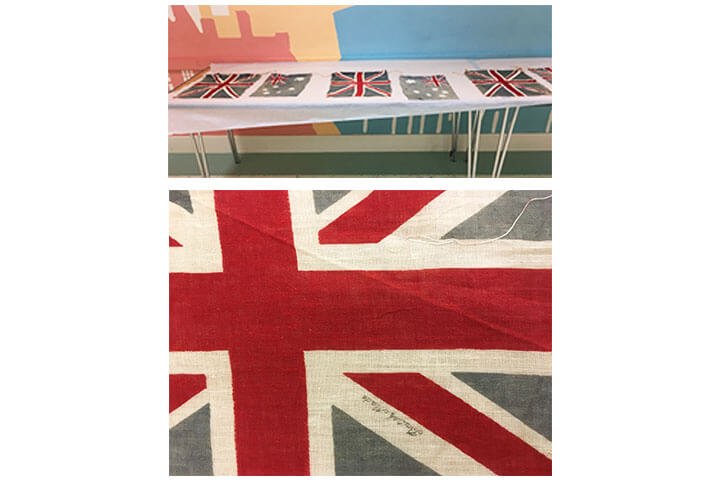 Union Jack flags and Australia flags on table.
