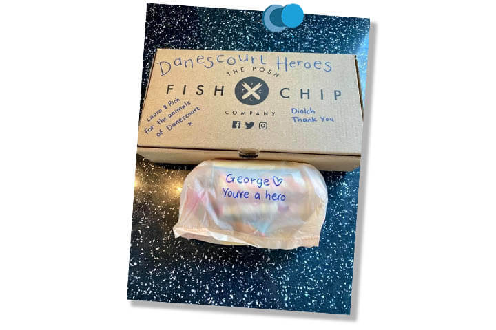 Fish and chips takeaway box and bag from The Posh Fish and Chips Company. Hand written messages on the packaging reads - Danescourt Heroes. Laura and Rich for the animals of danescourt x. Diolch Thank You. George you're a hero.